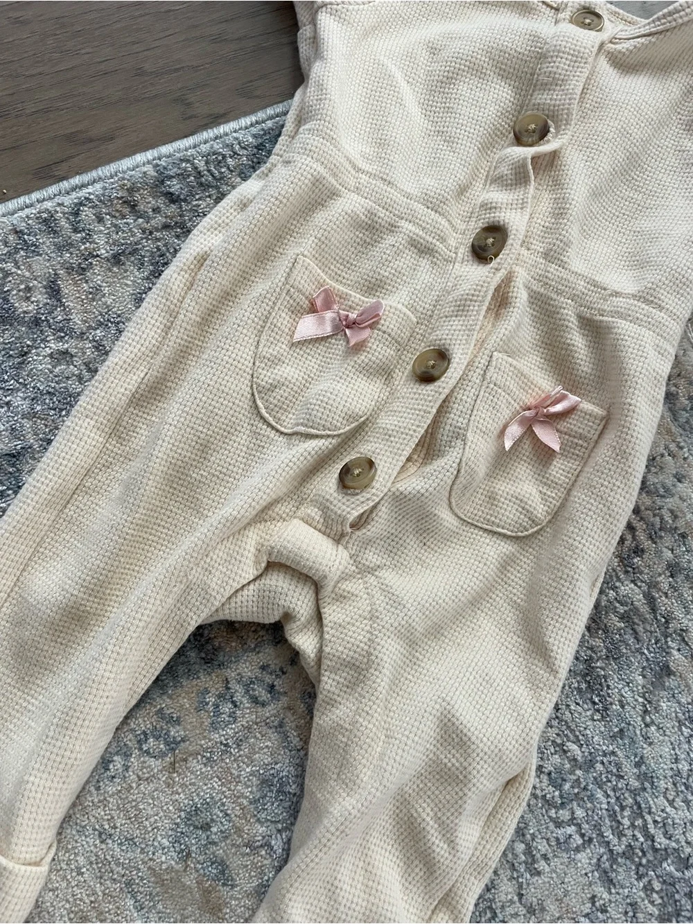 Cream Baby One-Piece Bodysuit with Pink Bow Pockets